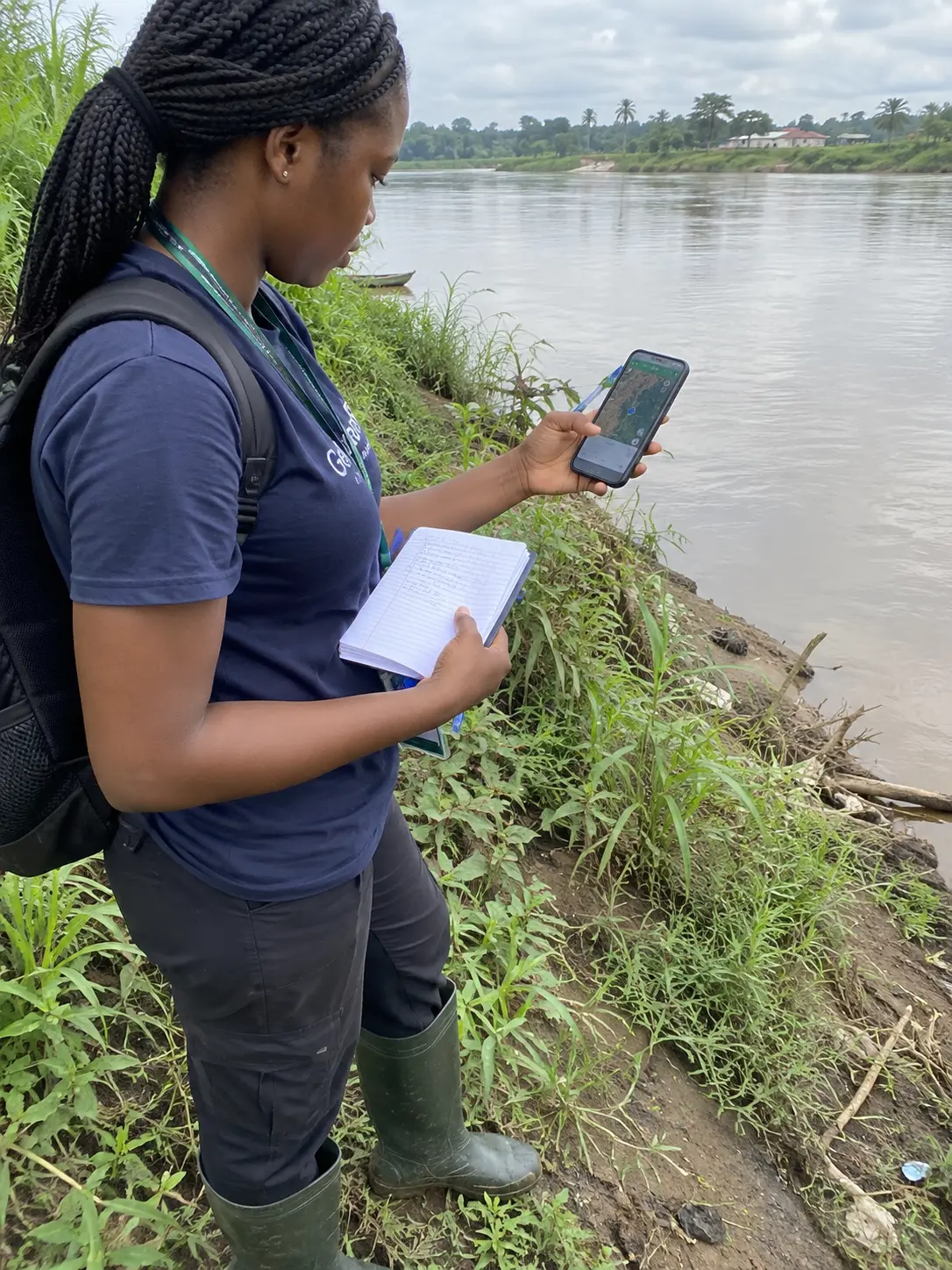 Student recording GPS coordinates for ground-truthing during environmental science fieldwork